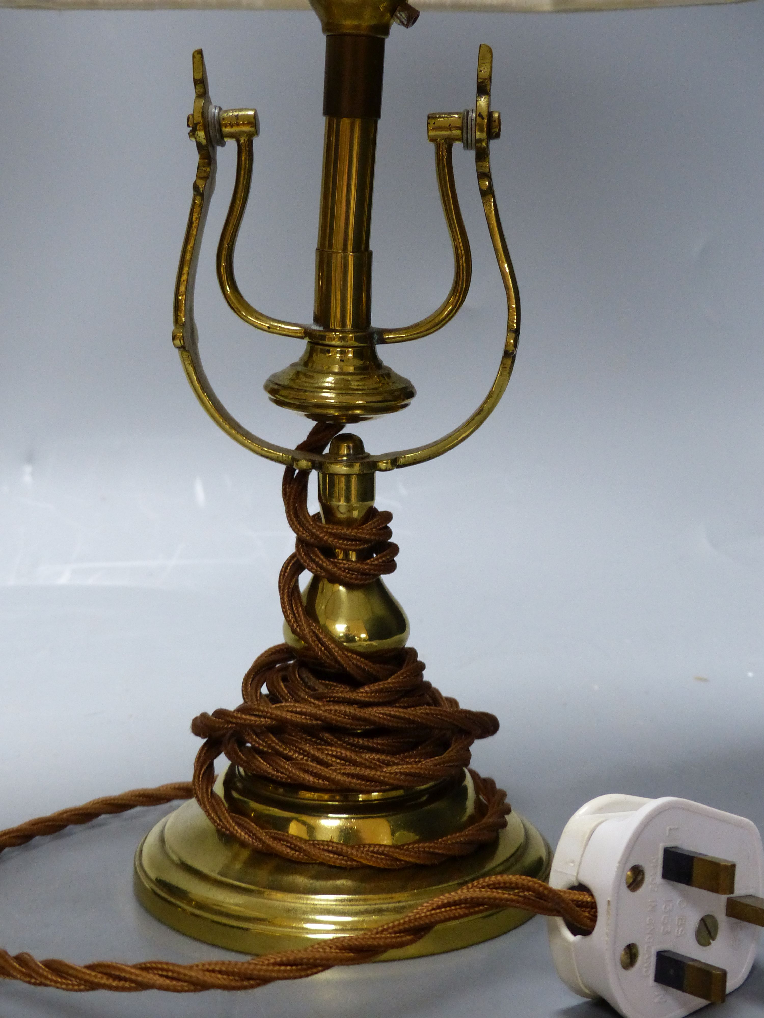 A pair of brass ship’s lamps, height 45cm